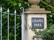 Sign on gate post saying Chapel Park